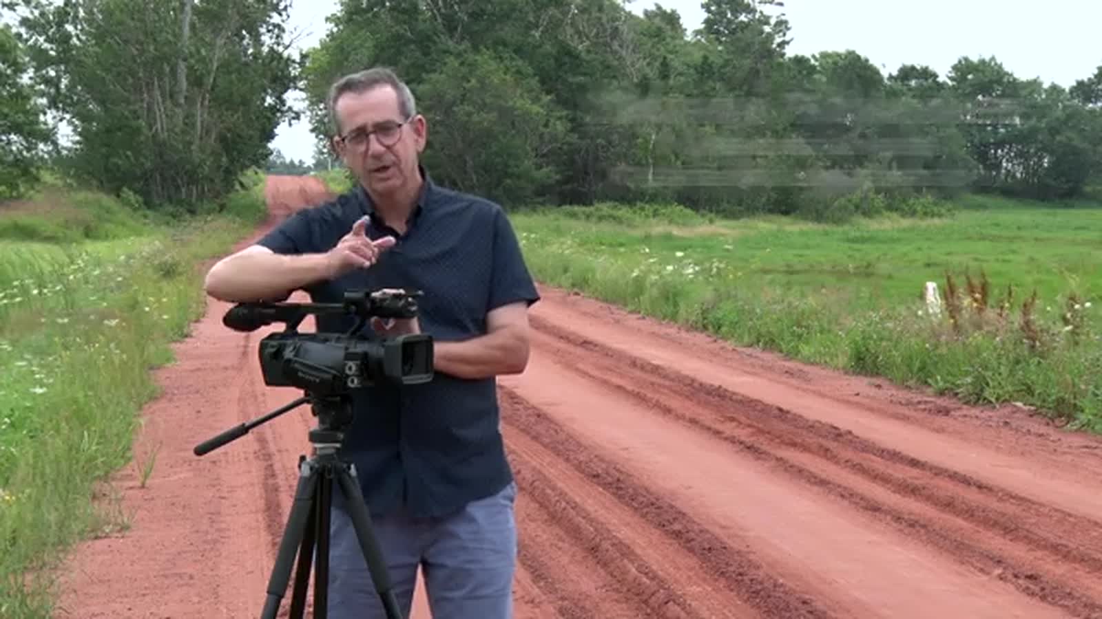 Darin Foulkes on a red dirt road, PEI